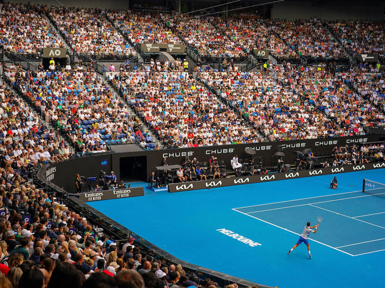 Tennis match on iconic blue courts at the Australian Open