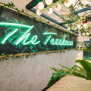 The Treehouse restaurant logo on the wall