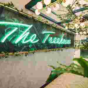 The Treehouse restaurant logo on the wall