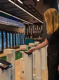 Patron using just walk out technology gate